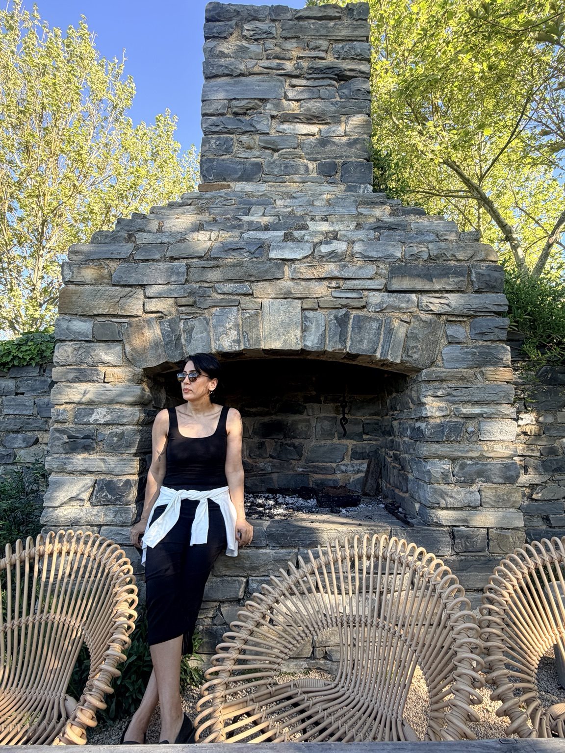 Fashion portrait beside a stone fireplace