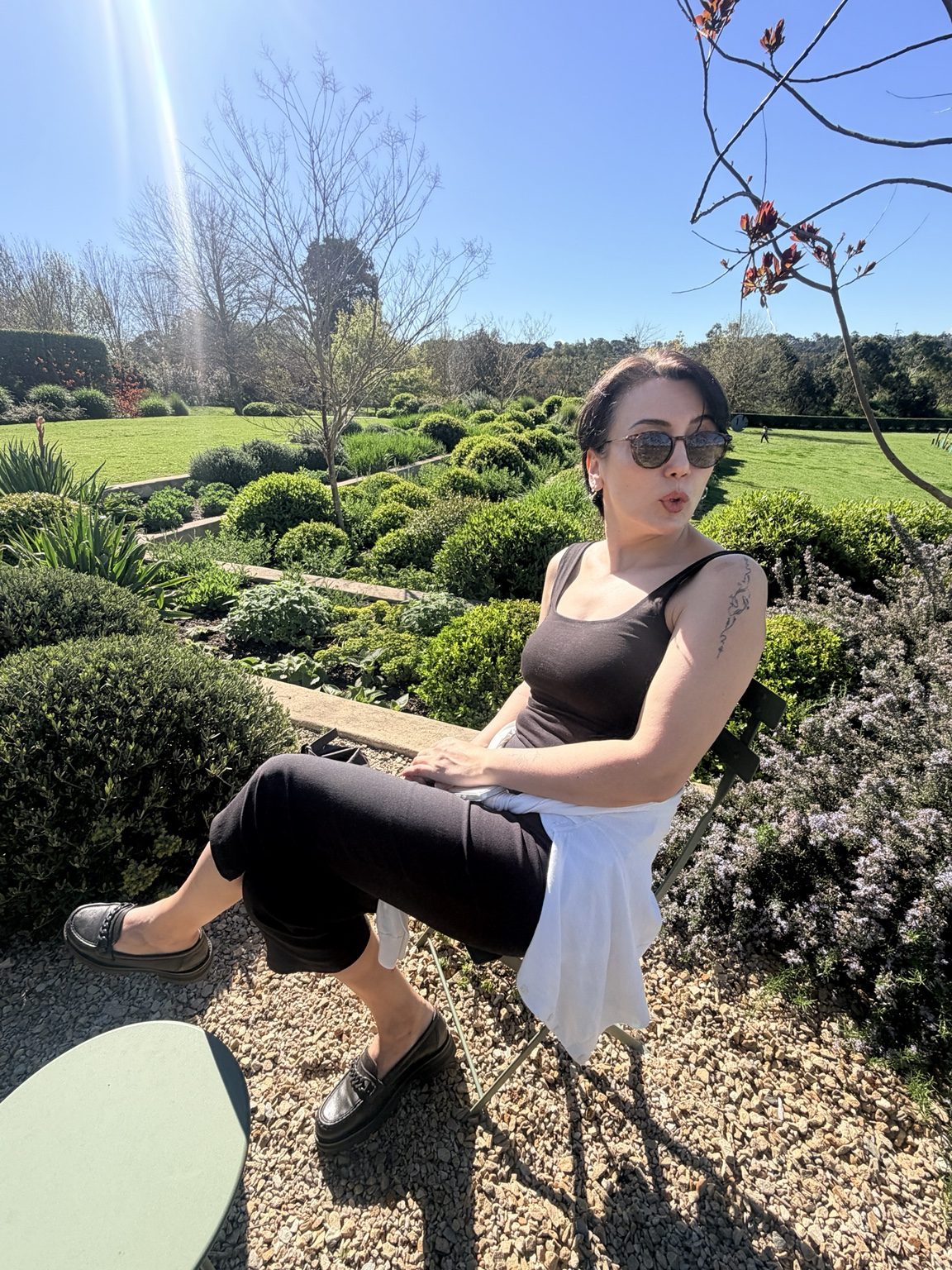 Vera enjoying a sunny day in a lush garden
