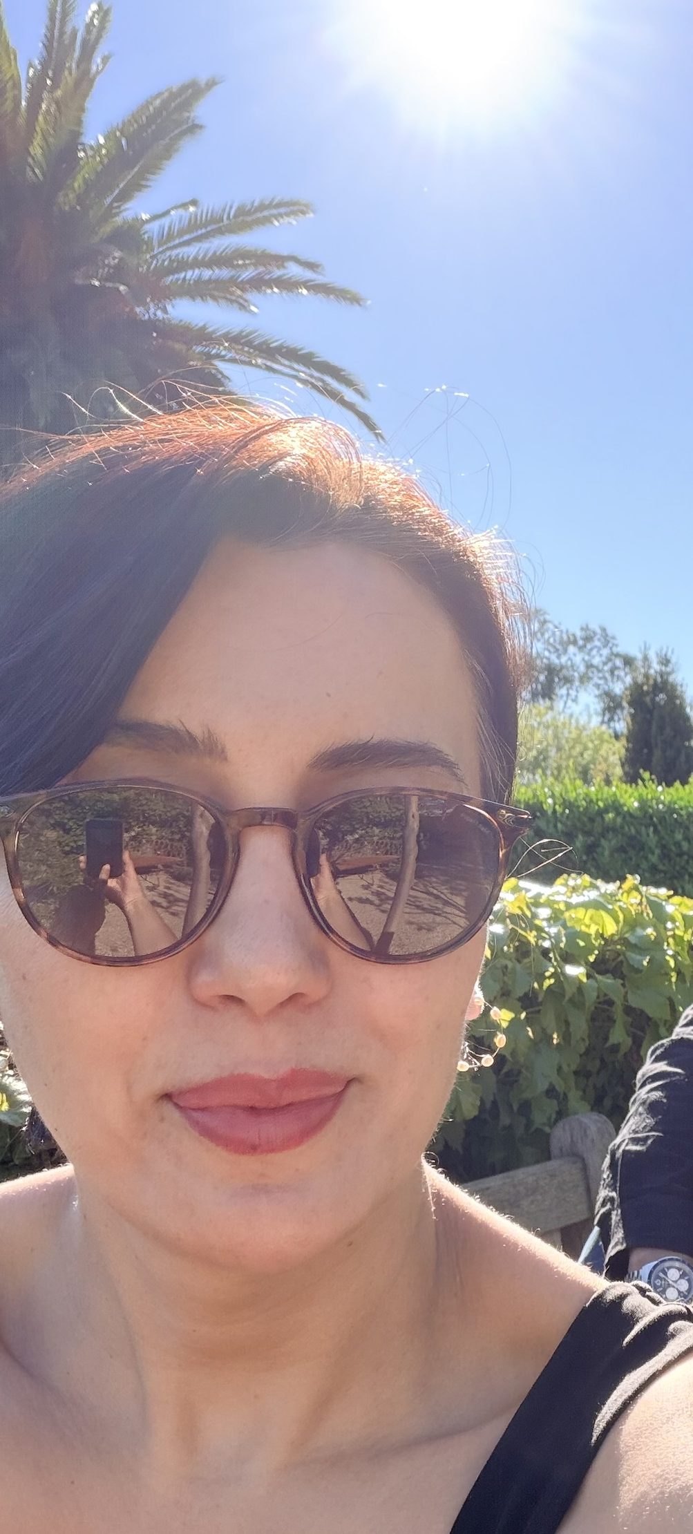 Sunlit close-up portrait with sunglasses